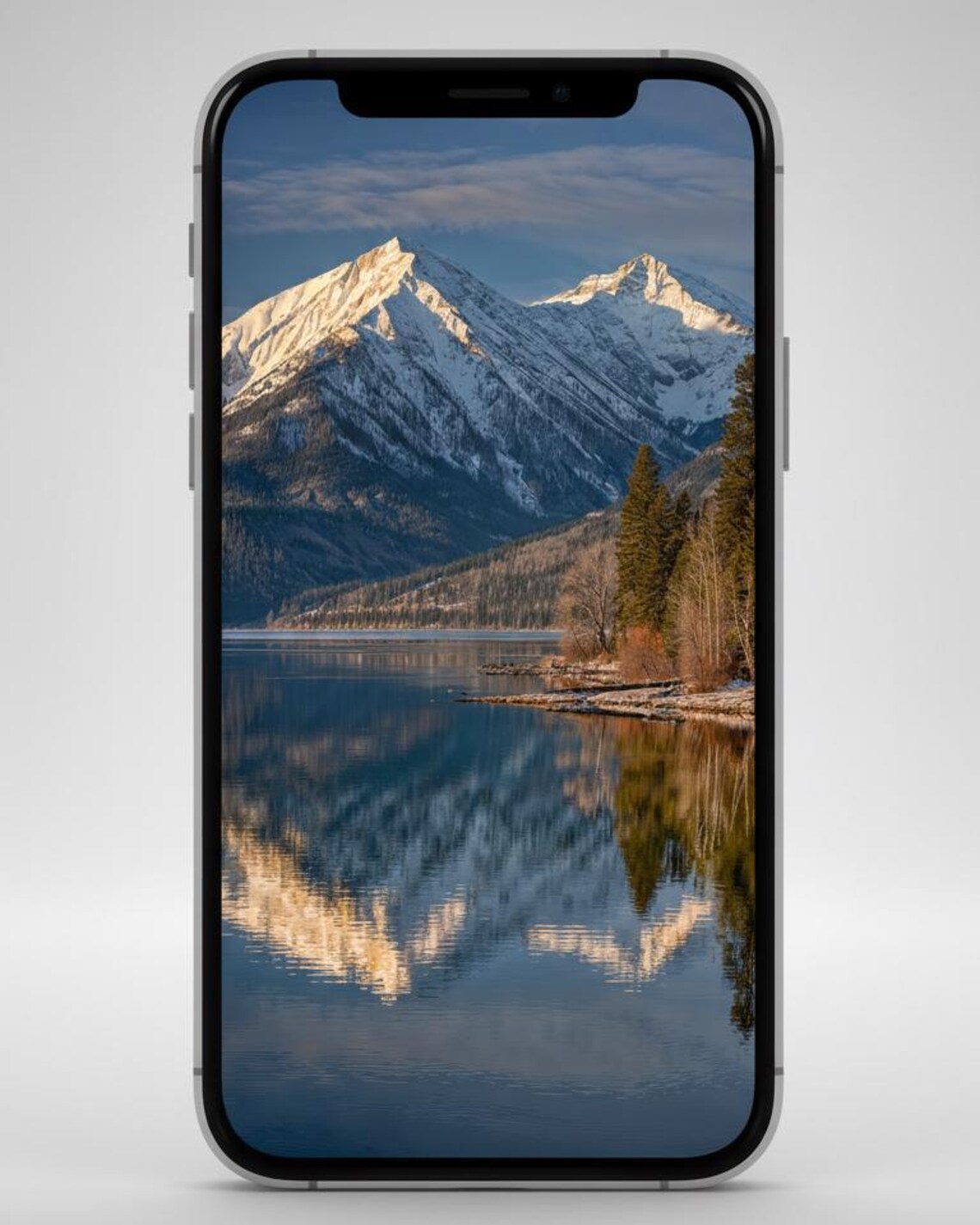 iPhone displaying a serene mountain and lake nature wallpaper from the digital wallpapers bundle