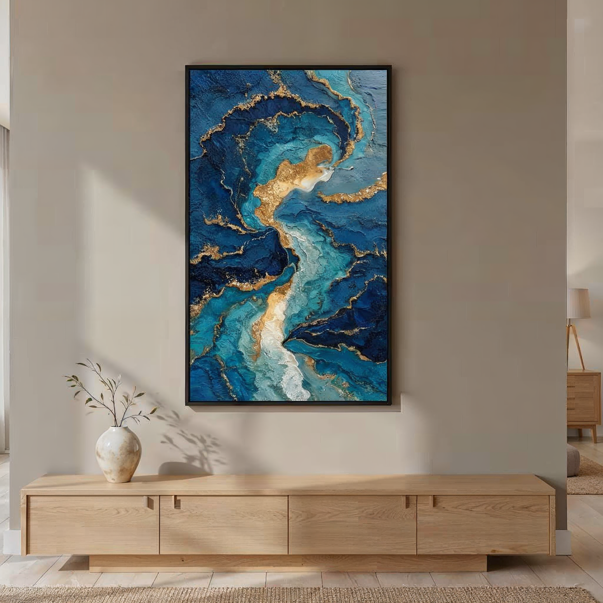 Velvet Void Rebellion abstract blue and gold art print, framed in black, hung in a minimalist living room